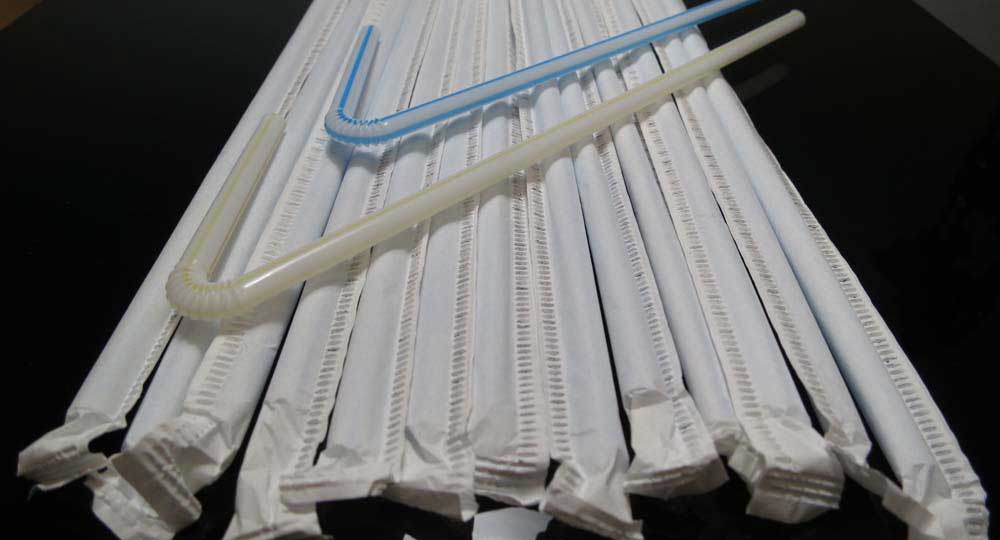 Straight straws wrapped in the paper